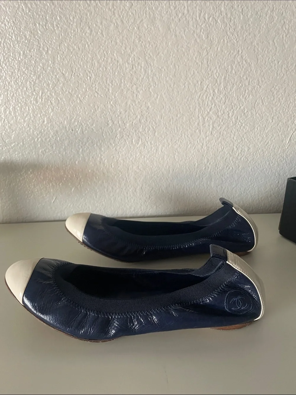 CHANEL Navy and Ivory Quilted Cap-Toe Ballet Flats